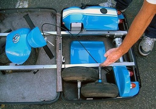 Illustration for article titled It's a Go-Kart That Folds Into a Suitcase. Any Questions?